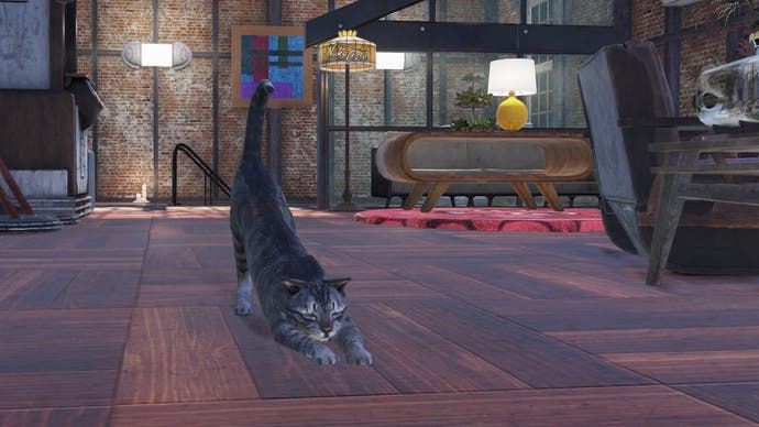 A cat stretches out on the floor of a camp in Fallout 76.