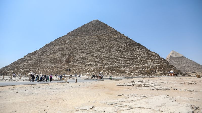 Dog seen hanging out on top of an ancient pyramid in Egypt