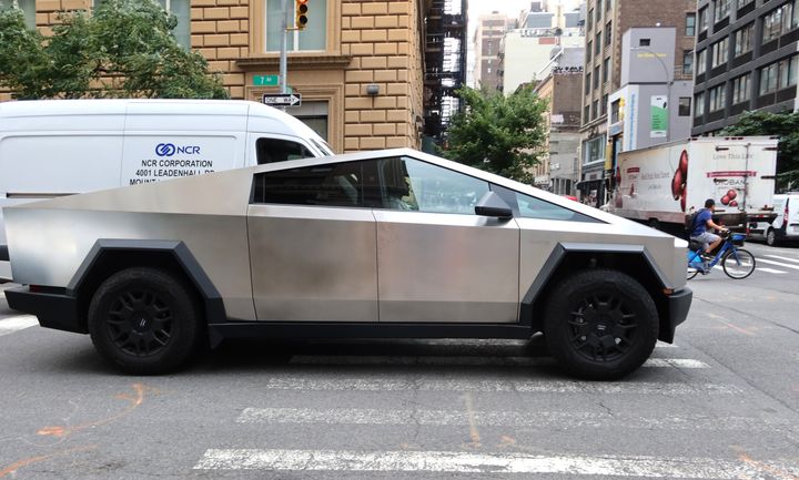 A Tesla Cybertruck drives on 7th Avenue on July 17, 2024 in New York City. 