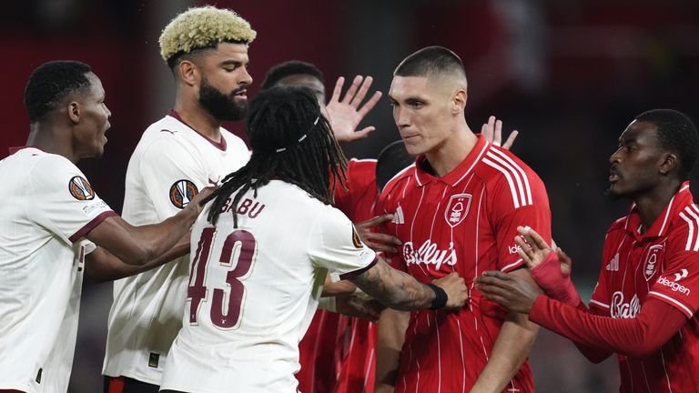 Nottingham Forest's Nikola Milenkovic exchanges words with Midtjylland's Kevin Mbabu during UEFA Europa League