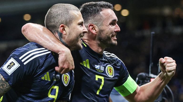 Lyndon Dykes (L) scored his 10th Scotland goal as John McGinn won his 80th cap against Greece