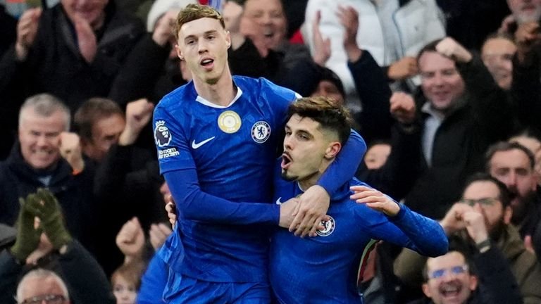 Cole Palmer celebrates with Pedro Neto after giving Chelsea the lead against Everton