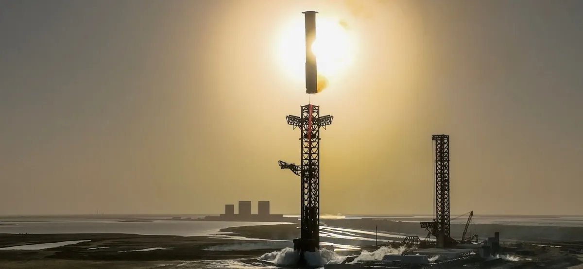 SpaceX's Starship booster landing at the company's Starbase facility in South Texas