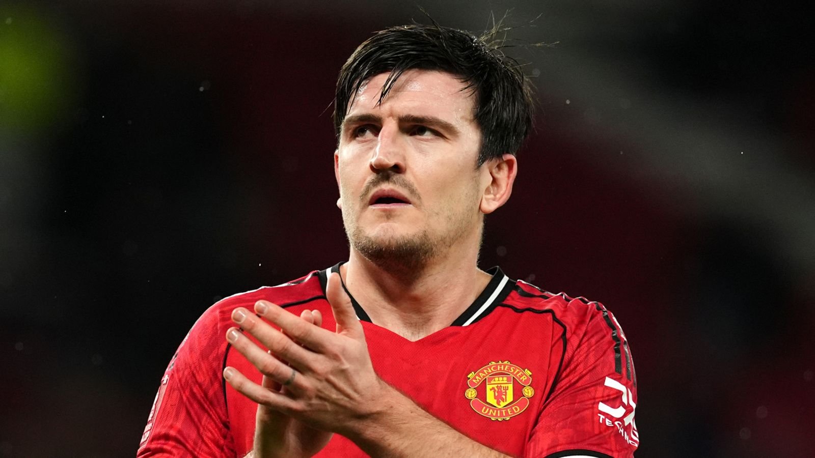 Harry Maguire applauds Old Trafford