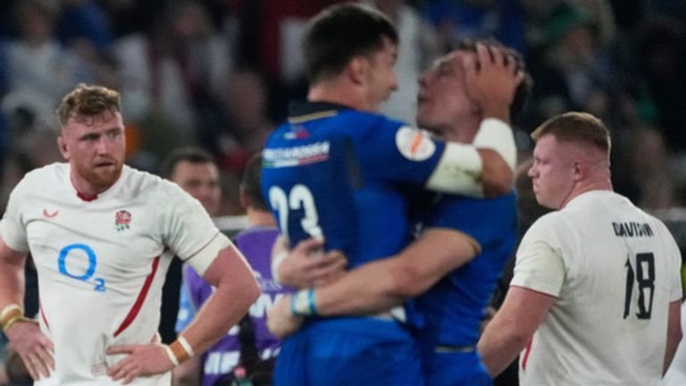 England players stand on the field at the end of the Six Nations rugby union match between Italy and England in Rome, Saturday, March 7, 2026. (AP Photo/Gregorio Borgia)