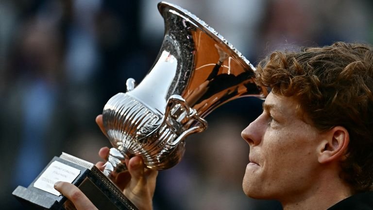 Italy's Jannik Sinner is the holder of the trophy after winning the men's final of the ATP Rome Open tennis tournament against Norway's Casper Ruud at 