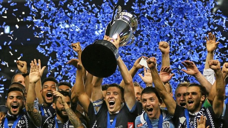 KANSAS CITY, KS - SEPTEMBER 20: Sporting Kansas City defenseman Matt Besler (5) hoists the Lamar Hunt US Open Cup trophy after their win over the New York Red Bulls on September 20, 2017 at Children's Mercy Park in Kansas City, KS. Sporting Kansas City won 2-1. (Photo by Scott Winters/Icon Sportswire)