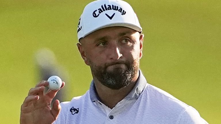 Jon Rahm of Spain waves after his putt on the 18th hole during the first round of the US Open golf tournament at Shinnecock Hills Golf Club in Southampton, N.Y., Thursday, June 18, 2026. (AP Photo/Gerald Herbert)