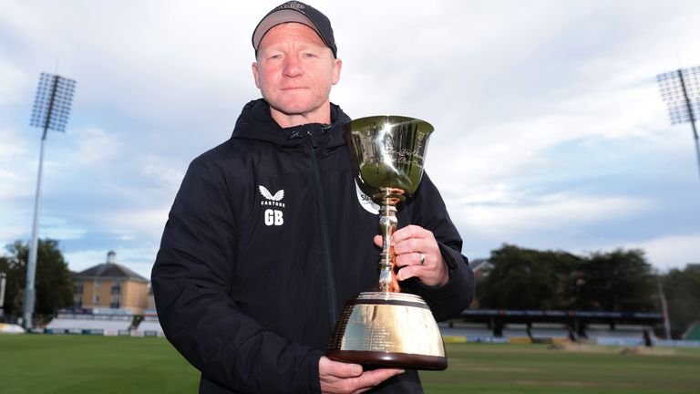 Gareth Batty poses with his third consecutive County Championship Division One trophy in 2024